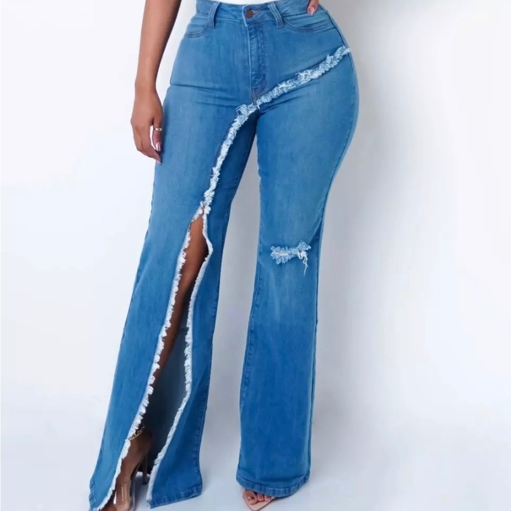 Stretch denim jeans with right leg, split and slight rips on back side